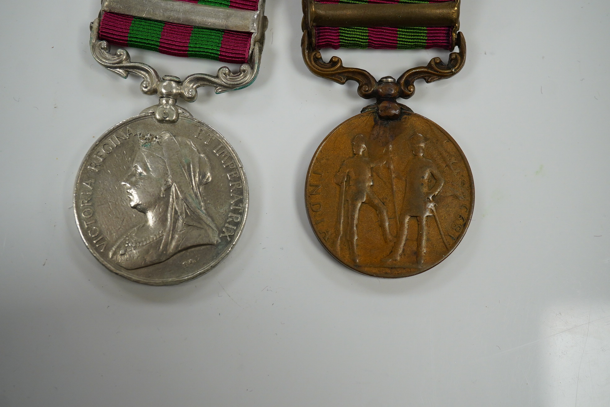 Two India Medals; one with Tirah 1897-98 clasp, naming worn/erased, the other in bronze with Punjab Frontier 1897-98 clasp to ...Transport Dept